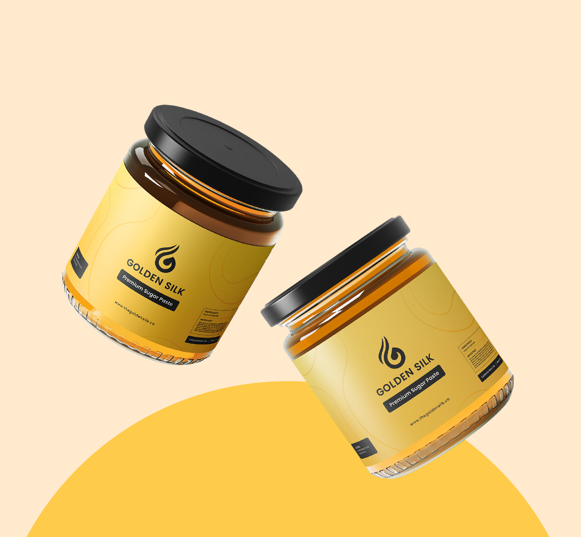 Two Golden Silk sugaring paste jars on a warm yellow background